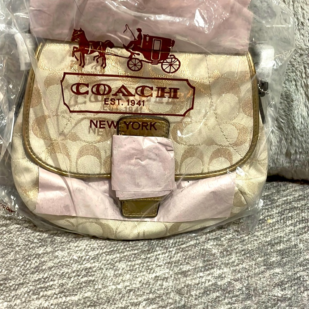 Brand new with tag Gold shimmering Coach purse